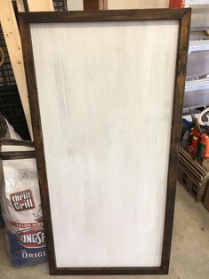 an old wooden frame with white paint on it