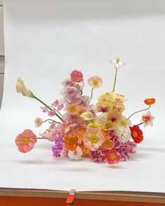 a bunch of flowers that are sitting on a table