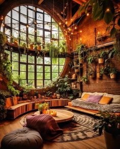 a living room filled with lots of plants next to a large round window covered in potted plants