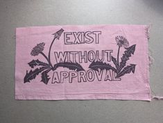 a piece of cloth that says, exist without approval on the front and back