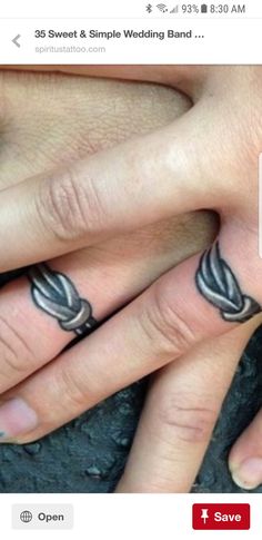 two people with wedding rings on their fingers