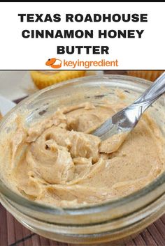 a jar filled with peanut butter sitting on top of a wooden table