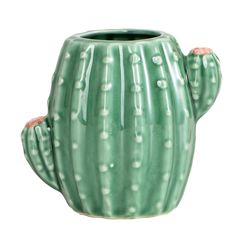 a green cactus shaped vase sitting on top of a table