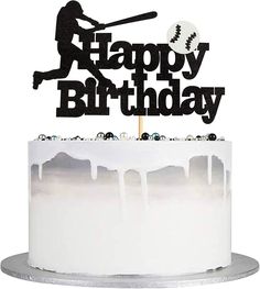 a cake topper that says happy birthday with a baseball bat and ball on it