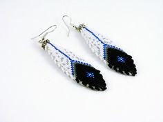 black and white beaded earrings with blue eyes