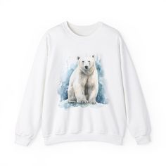 For the colder weather, for the winter nights, keep warm and cozy with a nice watercolor Polar Bear sweatshirt - only in white to really match that artic aura - Perfect for those who can't stay warm, love bears, love animals, or just love a nice sweatshirt! Ideal for any situation, a unisex heavy blend crewneck sweatshirt is pure comfort. These garments are made from polyester and cotton. The collar is ribbed knit, so it retains its shape even after washing. There are no itchy side seams on these sweaters.  .: Made with a medium-heavy fabric blend of 50% cotton and 50% polyester (8.0 oz/yd² (271.25 g/m this sweatshirt feels cozy and is the perfect choice for those colder months. .: The classic fit along with the crew neckline deliver a comfy wearing experience with a clean-cut style. Meanw White Relaxed Fit Sweatshirt For Winter, White Winter Sweatshirt With Graphic Print, White Graphic Print Sweatshirt For Winter, White Graphic Print Sweater For Winter, Cozy White Sweatshirt With Graphic Print, Cozy White Tops With Graphic Print, Cozy White Top With Graphic Print, Casual White Tops With Watercolor Print, White Top With Graphic Print And Cozy Fit