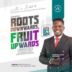 a man wearing a suit and tie standing in front of a sign that says roots forward fruit upwards