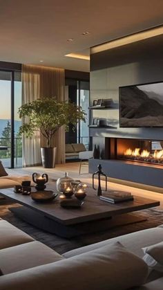 a living room with a large window and a fire place in the middle of it