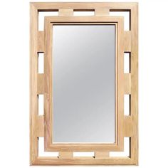 a wooden frame mirror on a white wall