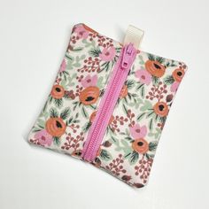 "So much easier to find your earbuds when they're safe and sound in this delightful little zip pouch! Good for a key or two, cash, lip balm, etc. -- One zippered pouch with a ribbon tab at the end, good for attaching to a key ring. -- About 3.5\" down the zipper x 2.5\" wide. -- Made with 100% quality cotton fabric. -- Machine washable, lay flat to dry. -- Your pattern may vary. Need a different size? Prefer a different fabric? Check out all the coffee coziez for different fabric possibilities. Custom orders are always welcome!  These make great gifts! Keep a couple on hand for those occasions when someone deserves a fun treat. Return to shop: https://www.etsy.com/shop/dizzlePOP" Functional Pink Pouch For Gift, Functional Pink Pouch Gift, Pink Pouch With Cell Phone Pocket, Pink Pouch With Cell Phone Pocket For Personal Use, Pink Coin Purse With Cell Phone Pocket For Gift, Pink Zipper Pouch Coin Purse, Earbud Pouch, Earbud Case, Zippered Pouch