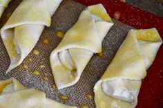 some dumplings are sitting on a baking sheet