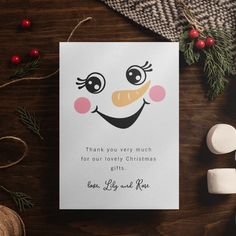 a christmas card with a snowman's face on it