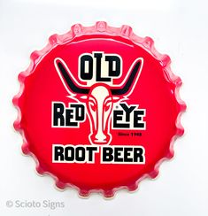 a red bottle cap with the words old red eye root's beer on it