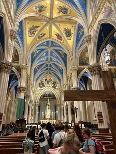 the interior of a church with many people inside