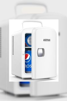 a mini fridge with soda and pepsi in it