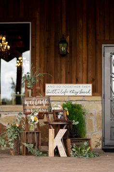 a couple of wooden chairs sitting next to each other on top of a stone floor