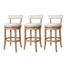 three wooden stools with white upholstered seats on each one and the other side