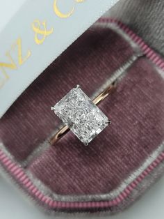 This astonishing 3.15 carats stand alone style ring has a 3.01 carat lab grown radiant cut center diamond and is IGI certified at "E" in color and "VS1" in clarity, (Excellent Cut, Polish and Symmetry) and is set in a classy solitaire hidden halo setting in 14K rose/white gold. Rose Gold Radiant Cut Engagement Ring, Two Tone Radiant Engagement Ring, Radiant Engagement Ring 3 Carat Lab Grown, Radiant 3 Carat Engagement Ring, 3carat Engagement Ring, Radiant Cut Engagement Ring Gold Diamond Band, 4 Ct Radiant Engagement Ring, 3 Carat Radiant Engagement Ring, 2 Carat Radiant Engagement Ring