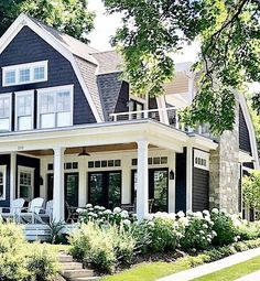 a black and white house with lots of windows