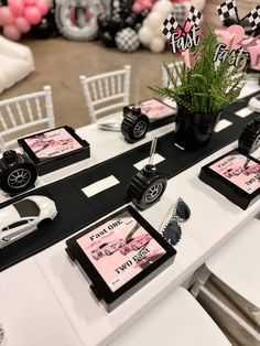 a table topped with lots of black and white decorations