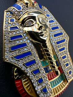 Gorgeous moissanite King Tut pendant
Custom handmade piece signifies royalty and wisdom
Finished in enamel for a unique look that stands out
PASSES DIAMOND TESTER!!! ANY PEN OR LIGHT TRANSMISSION DIAMOND TESTER (Will show up as moissanite and not diamond on lab assays however)
1.3ct genuine D Color VVS1 moissanite..SO ICY THEY WILL BLIND YOU!
Comes with GRA certificate
SUPER ICY!
Solid 925 sterling silver
 
We have 2 styles! natural silver & 14k yellow gold vermeil!
Measu 10k Gold Chain, Red Stone Ring, Diamond Tester, Colored Engagement Rings, King Tut, Moissanite Earrings, Turquoise Rings, Gold Bracelet Chain, Chains Jewelry