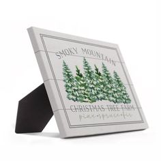 a christmas tree farm soap bar in a white box with black ribbon on the front