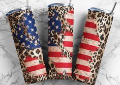 two leopard print tumblers with the american flag on them, sitting next to each other