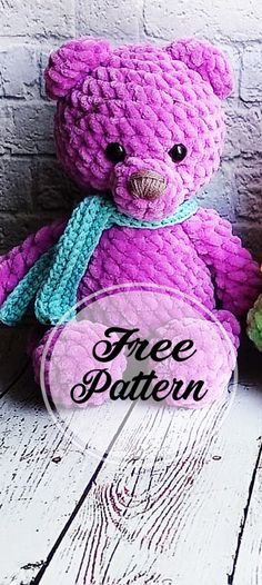 a purple teddy bear with a blue scarf around its neck and the words free pattern below it