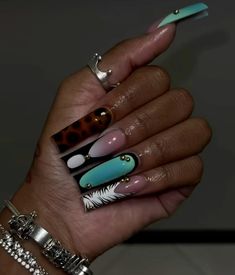 a woman's hand with different nail designs on it