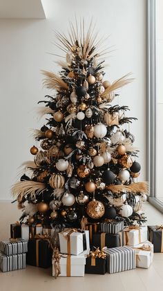 Modern black and white Christmas tree with metallic ornaments, natural elements, and presents on a white wooden floor. Christmas Tree Decorations Gold Silver, Bronze And White Christmas Tree, Happy New Year Tree Ideas, Black White Brown Christmas Tree, Gold White And Black Christmas Tree, White Gold Black Christmas Tree, Black And Copper Christmas Decor, Snowman Theme Christmas Tree, New Years Eve Tree Ideas