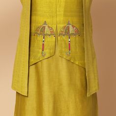 A very unique 3 paneled kurta with embroidery of an umbrella inspired from a chariot. Same color cotton lycra churidar Fabric- cotton chanderi, raw silk. Yellow is a bright and playful color, this outfit is perfect for a groom or as a brother of the bride or groom. Can be worn for Sangeet or Mehandi for a day or night event. Delivery: 20 Days Fitted Yellow Cotton Silk Kurta, Cotton Nehru Jacket For Navratri Designer Wear, Fitted Cotton Silk Kurta With Cutdana, Green Chanderi Nehru Jacket Straight Kurta, Green Chanderi Nehru Jacket In Straight Kurta Style, Fitted Chanderi Nehru Jacket Straight Kurta, Designer Tussar Silk Fitted Kurta, Designer Fitted Tussar Silk Kurta, Fitted Tussar Silk Kurta For Designer Wear