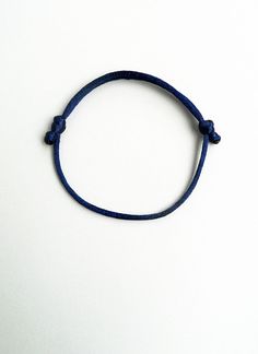 Sailor knot This handmade bracelet is made using 2mm thick rattail navy blue satin cord. It is easily adjusted to fit any size of wrist comfortably. Similar rattail bracelet: https://www.etsy.com/listing/230001118/kabbalah-red-braceletsimple?ref=shop_home_active_5&ulsfg=true More string bracelets in my shop: https://www.etsy.com/shop/LuckyRatJewellery?section_id=16685466&ref=shopsection_leftnav_2 *Colours may differ slightly from the original due to the configuration of your computer. *There ma Casual Navy Bracelet As A Gift, Casual Navy Bracelets For Gifts, Blue Nylon Cord Friendship Bracelets With Sliding Knot, Blue Sliding Knot Friendship Bracelets In Nylon Cord, Blue Waxed Cord Friendship Bracelets With Sliding Knot, Blue Sliding Knot Friendship Bracelet With Nylon Cord, Blue Waxed Cord Bracelet With Sliding Knot, Blue Nylon Cord Bracelets With Adjustable Length, Minimalist Nylon Cord Friendship Bracelet With Sliding Knot