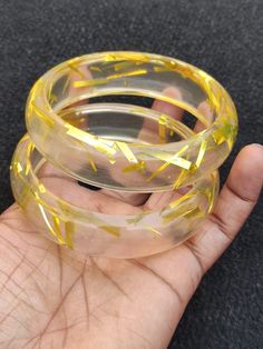 You will receive 2 pcs set Transparent Yellow Resin Bangle Bracelet Purely Handcrafted Exclusive Retro Wide Bangle Trendy Unique Fashion Jewelry for Women.  Bangle innerdiameter Size:  2.6" Approx. Bangle Width Siz : 19 mm  Many thanks for you visit my store ♥ if you have any question please contact us. For wholesale Price Please Convo me. You can order different items as many you like . Adjustable Resin Bangle, Gold Resin Bracelet, Yellow Plastic Party Jewelry, Resin Bracelets As Gifts, Handmade Plastic Bangle Bracelets, Plastic Bracelets As A Gift, Adjustable Yellow Round Bangle, Plastic Round Jewelry For Parties, Yellow Resin Jewelry For Party