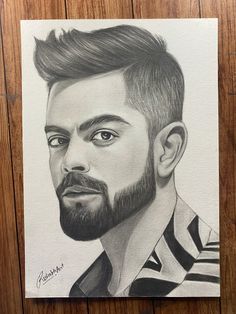 a pencil drawing of a man's face with a beard and striped shirt on