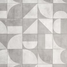 an abstract tile design in grey and white