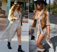 two women in dresses and hats walking down the street with one holding a cell phone