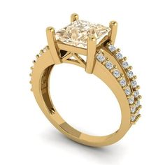 a yellow gold engagement ring with a princess cut diamond in the center and side stones