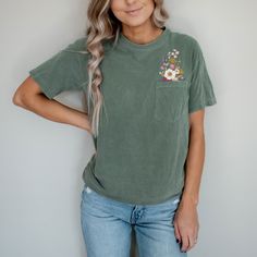 "Faux Embroidery Wild Flower Comfort Heavyweight Premium Pocket Tees | Unisex Sizing This basic comfy tee is great to wear as a casual top to the beach, or pool, or pair it with jean cut off shorts and sandals for a casual daytime look. You will want one of every color and will be a favorite to wear!  Perfect comfort for the coming spring days!  These soft-washed garment-dyed fabric tees are made from 100% ring-spun cotton.   Details: Short sleeve t-shirt Double-needle collar Taped neck and shou Pocket Tshirt Designs, Pocket Flowers, Embroidered Jean Shorts, St. Patrick’s Day, Pocket Tees, Cottagecore Shirt, Look Retro, Boho Shirts, St Patrick Day Shirts