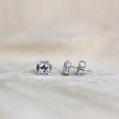 Metal: 925 Sterling Silver Stone Cut: Asscher Cut, Brilliant Cut, Baguette Cut Earring Dimension: 7.0mm (L) x 7.0mm (W) Setting Type & Style: Post, Stud, Prong Total Stone Weight: 1.18 cttw Silver Emerald Cut Diamond Earrings With Baguettes, Silver Emerald-cut Baguette Diamond Earrings, Silver Octagon Classic Earrings, Sterling Silver Earrings With Baguette Cut And Prong Setting, Silver Octagon Diamond Earrings, Octagon White Gold Earrings With Prong Setting, Silver Diamond Octagon Earrings, White Gold Octagon Earrings With Prong Setting, Cubic Zirconia Baguette Cut Diamond Earrings With Prong Setting