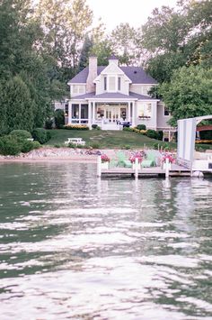 a large house sitting on top of a lake