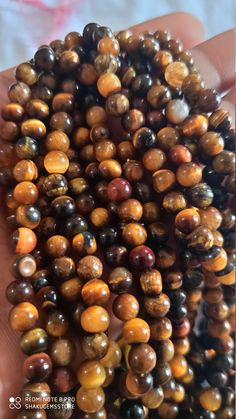 13 Inch Natural tiger eye Smooth Round Loose Beads brown colour 6mm Stone : Natural tiger eye Length - Approx 13 inch Shape :- Round Size :- approx 6mm 8mm Polish :- Handmade Purity :- 100% Natural Gemstone color - brown It is known as the 'love stone' as the message it emits is the strong vibration of unconditional love, joy, warmth and healing. As quartz crystals are profound amplifiers of energy, it may help to kindle happiness, love, romantic feelings and sensuality. It is good for people in Romantic Feelings, Carnelian Bracelet, Love Romantic, 108 Bead, Brown Colour, Quartz Crystals, Bead Stringing, Little Flowers, Black Eyed Peas