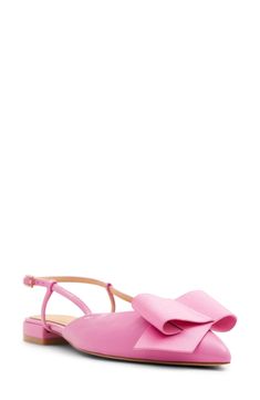 a pink shoe with a bow on the side