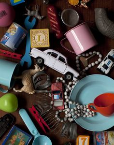 a table topped with lots of toys and other items