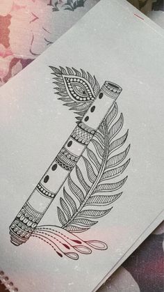 a piece of paper with a drawing of a feather on it's side and some flowers in the background