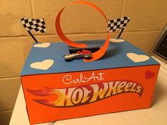 a candy box that is shaped like a hot wheels car