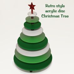 a green and white christmas tree with a red star on it's top that says retro style acrylic disc christmas tree