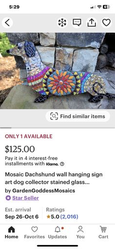 an image of a lizard made out of glass on a stone wall with the price tag below it