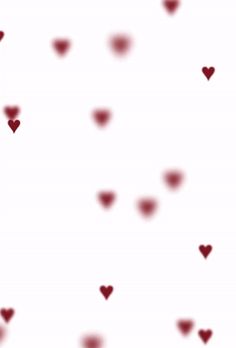 red hearts floating in the air on a white background