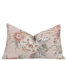 a pink floral pillow on a white background