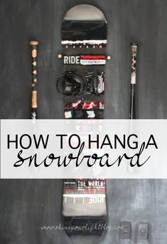 a snowboard and ski poles with the words how to hang a snowboard on it